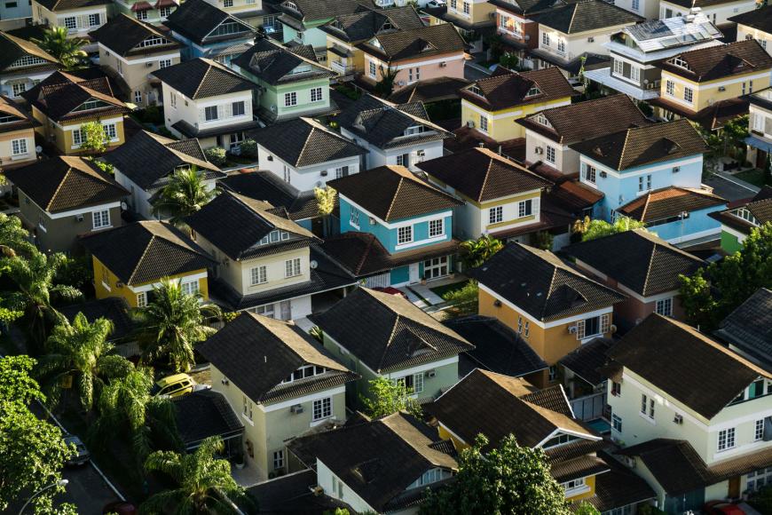 A well kept home stands out amidst the rest of the neighborhood