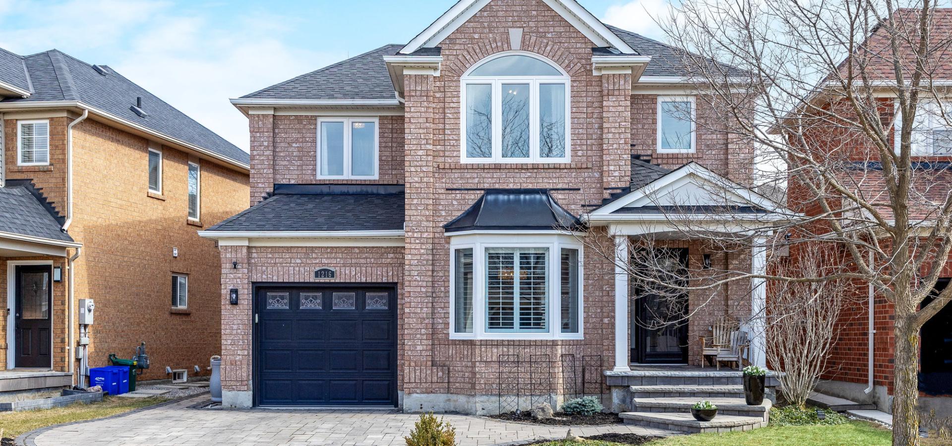 Elegant brick home with single garage and interlocking drive