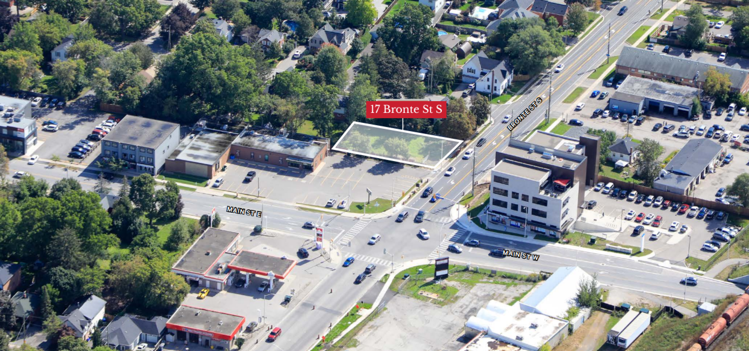 Aerial view of vacant lot surrounded by local businesses