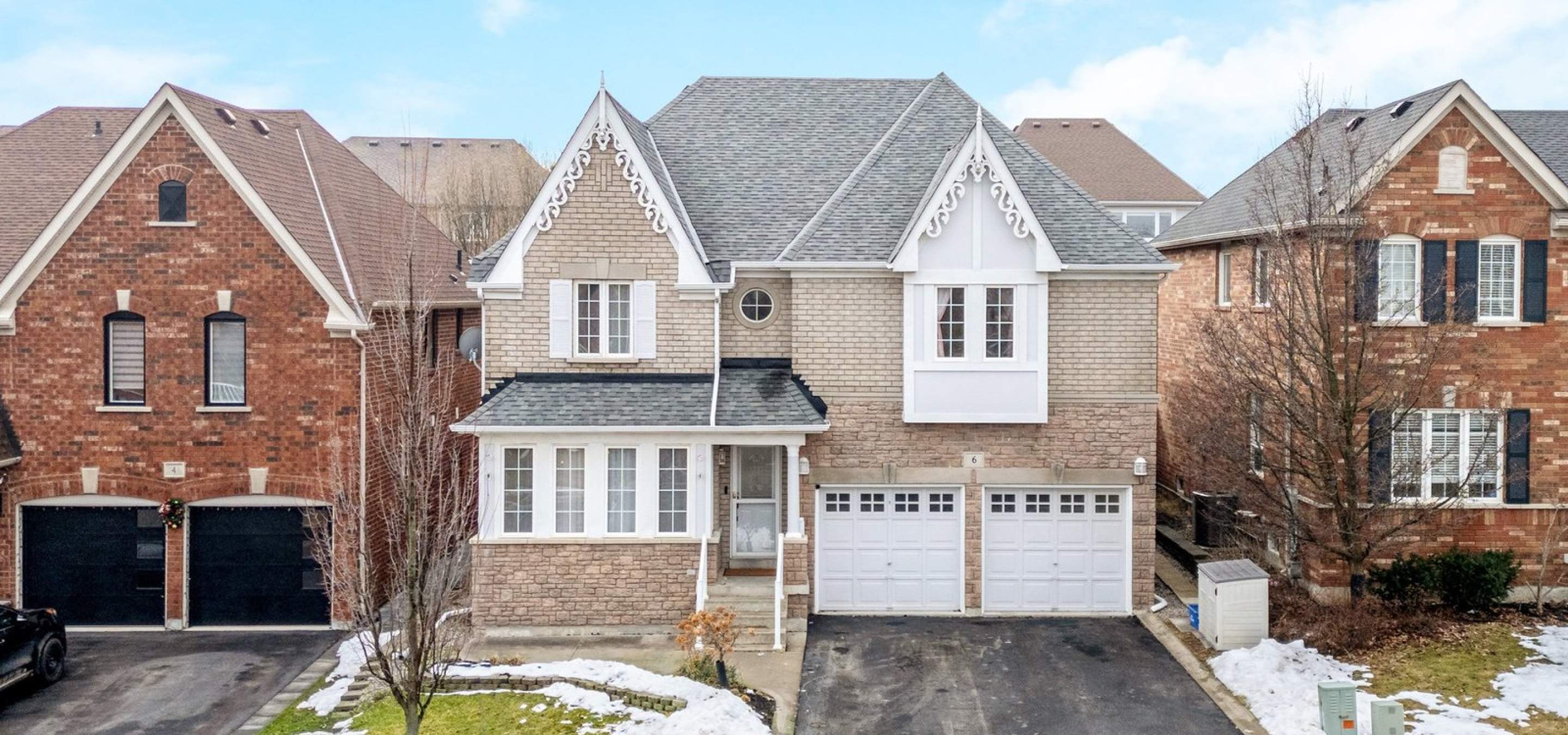 Exterior photo of home with double garage.