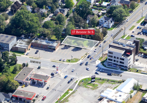 Aerial view of vacant lot surrounded by local businesses